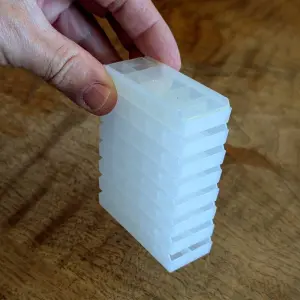 Trays stacked with lids supported
