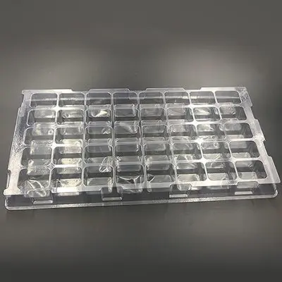 Plastic shipping tray with 2" cavities.